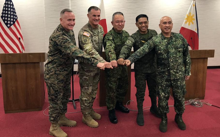 Generals from the U.S., Japan and the Philippines pose at Camp Asaka, Japan, Sunday, Dec. 11, 2022. From left to right: U.S. Marine Corps Forces Pacific commander Lt. Gen. William Jurney, U.S. Army Pacific commander Gen. Charles Flynn, Japan Ground Self-Defence Force commander Gen. Yoshihide Yoshida, Philippine army commander Lt. Gen. Romeo Brawner and Philippine marine corps commandant Maj. Gen. Charlton Sean Gaerlan.