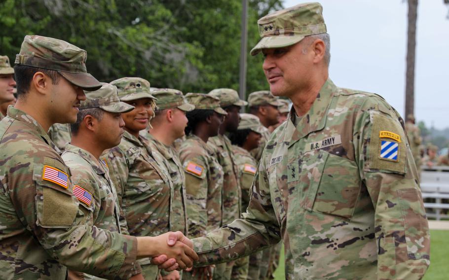 Army Maj. Gen. Charles Costanza shakes soldiers’ hands after a reenlistment ceremony at Fort Stewart, Ga., May 19, 2023. Costanza, promotable to lieutenant general, was named the next commander of V Corps.