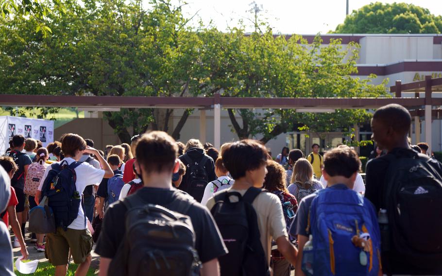 Students head to Zama Middle High School on the first day of classes at Camp Zama, Japan, Monday, Aug. 21, 2023.