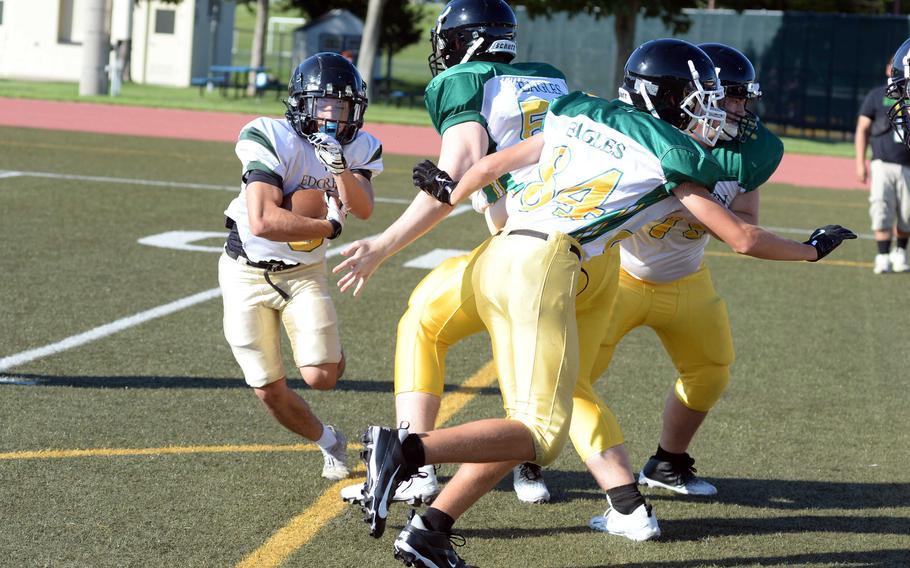 Haruki Jones runs with the ball in practice.