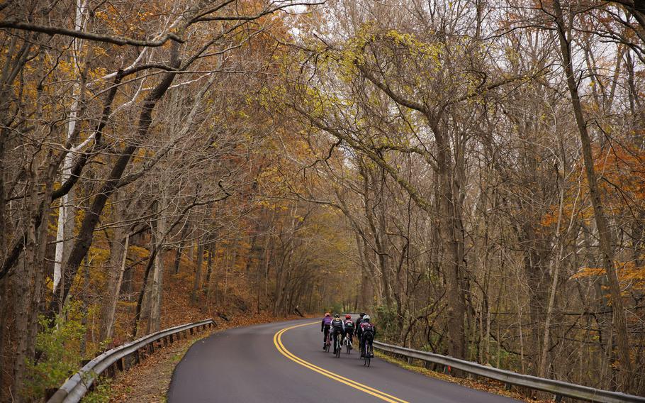 Cyclists on Old State Road 37 in Bloomington, Ind., on Nov. 13, 2021. 