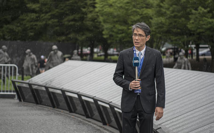 Seoul Broadcasting System reporter Seung Mo-Nam reports on the new Wall of Remembrance at the Korean War Memorial in Washington, D.C., on Tuesday, July 26, 2022.