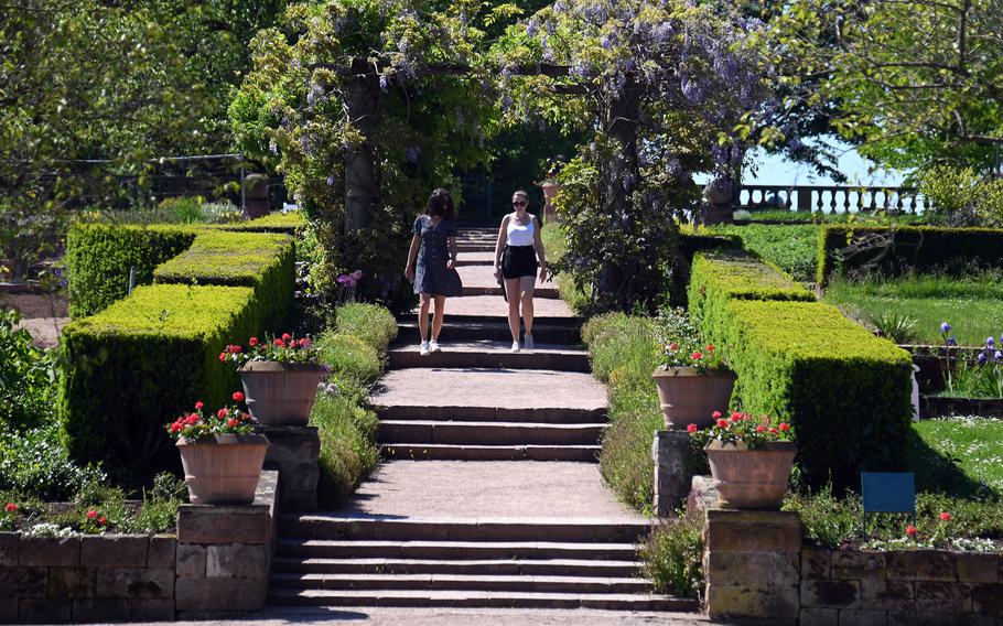 Two visitors to Rosenhoehe Park in Darmstadt, Germany, walk through the Rosarium. The park, on the eastern end of the city, was founded by Grand Duchess Wilhelmine of Hesse at the beginning of the 19th century.