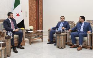 Al-Sharaa, Al-Shibani and Al-Ahmad each sit in chairs as they discuss the election.