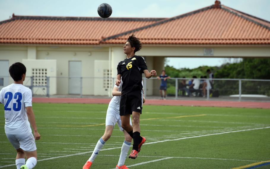 Kadena's Elias Cedeno heads the ball against CAJ.