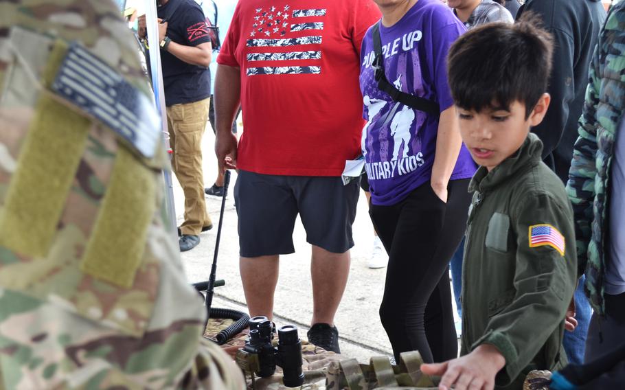 Jeremy Matthews, the 10-year-old son of a Navy retiree, asks questions about Air Force special warfare equipment at The Great Texas Airshow on Saturday, April 6, 2024, at Joint Base San Antonio-Randolph Air Force Base.