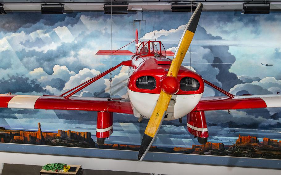 The Loving WR-3 aircraft hangs in front of Eric Sloane’s “Earth Flight Environment Mural.”