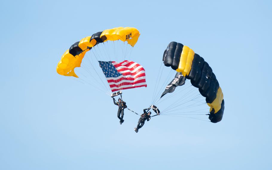 Members of the U.S. Army Golden Knights descend from the sky during the Beyond the Horizon Air and Space Show at Maxwell Air Force Base, Ala., Saturday, April 6, 2024. 