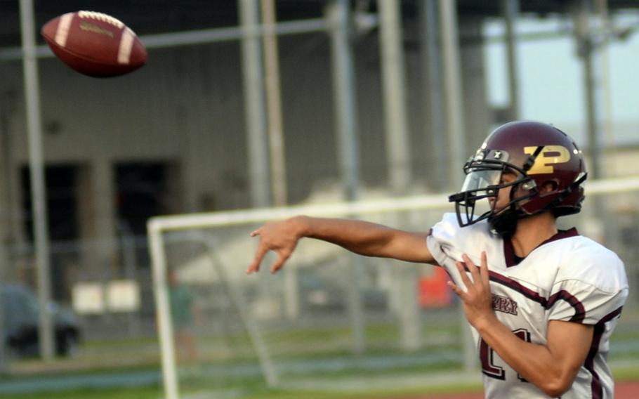 Kameron Ramos throws the football.