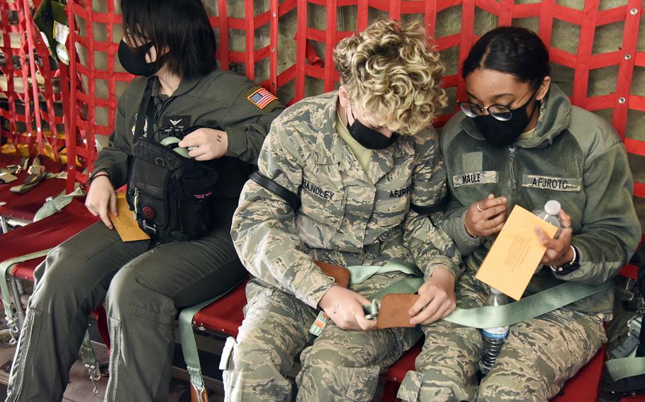 Yokota High School students prepare for takeoff aboard a C-130J Super Hercules at Yokota Air Base, Japan, Tuesday, March 8, 2022. 