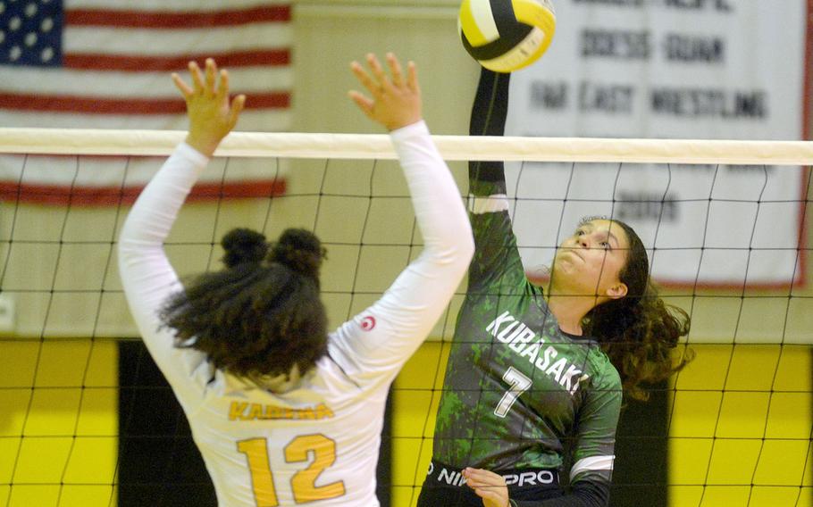 Kubasaki's Sophia Grubbs spikes past Kadena's Malana Williams during Tuesday's Okinawa volleyball match. The Dragons beat the Panthers in straight sets for the fifth time this season.