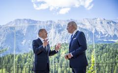 German Chancellor Olaf Scholz, left, welcomes US President Joe Biden, right, for a bilateral meeting at Castle Elmau in Kruen, near Garmisch-Partenkirchen, Germany, on Sunday, June 26, 2022. The Group of Seven leading economic powers are meeting in Germany for their annual gathering Sunday through Tuesday. (Michael Kappeler/dpa via AP)