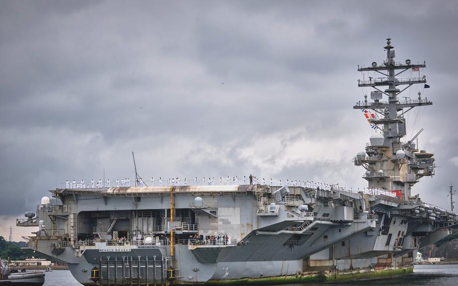 The aircraft carrier USS Ronald Reagan arrives at Yokosuka Naval Base, Japan, its homeport, on Oct. 16, 2021, after five months at sea. 