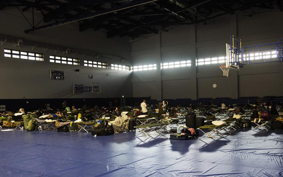 Many delayed Patriot Express passengers slept on cots inside a gym at Marine Corps Air Station Iwakuni, Japan, after a hard landing on Tuesday, July 13, 2021, forced their flight to return to Tokyo for repairs. 