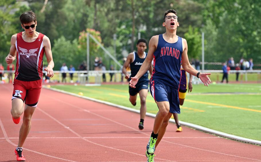 Aviano’s Everett Taylor reacts after winning the boys 400-meter race in 50.90 seconds at the DODEA-Europe track and field championships in Kaiserslautern, Germany, May 20, 2023. At right is Kaiserslautern’s Brandon Seyler, who placed second.