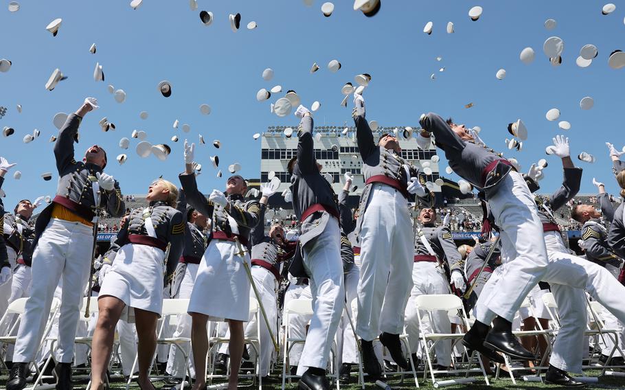 In this photo from May 27, 2023, graduating cadets toss their hats into the air following the conclusion of ceremonies at Michie Stadium at West Point’s graduation in West Point, N.Y.