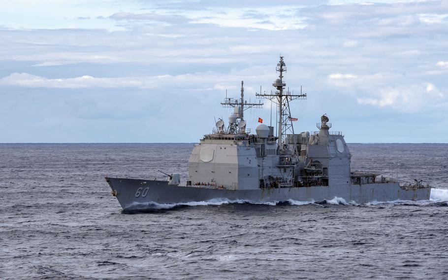 The cruiser USS Normandy steams alongside the aircraft carrier USS Gerald R. Ford before a replenishment at sea, Nov. 2, 2022. The commanding officer of USS Normandy, Capt. Simon McKeon, was relieved Nov. 8 due to a loss of confidence in his ability to command.