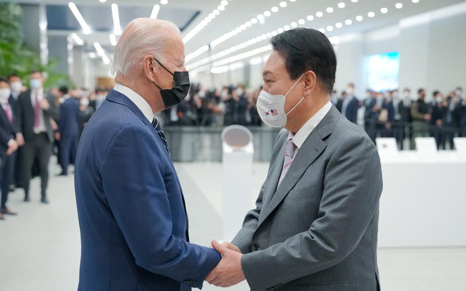 President Joe Biden and South Korean President Yoon Suk Yeol shake hands on May 20, 2022. 
