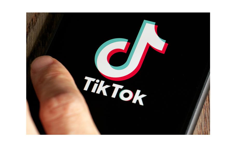 A mobile phone with a TikTok logo on the screen.