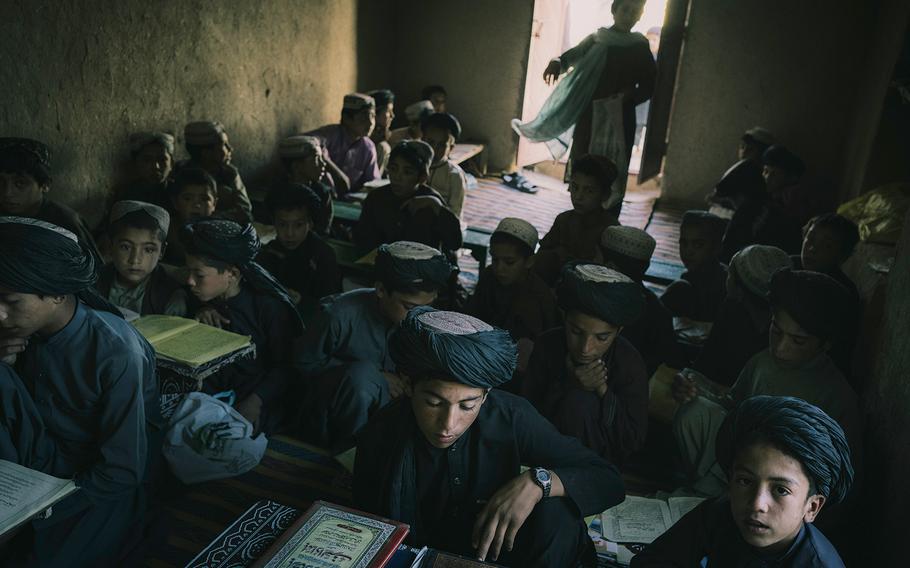 Children attend class at a Taliban madrassa in Sangin, on June 14, 2022.