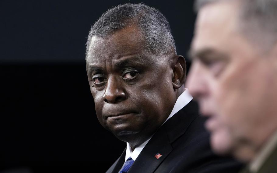 Defense Secretary Lloyd Austin, left, listens as Chairman of the Joint Chiefs of Staff Gen. Mark Milley, right, speaks during a briefing at the Pentagon in Washington on Thursday, May 6, 2021. 