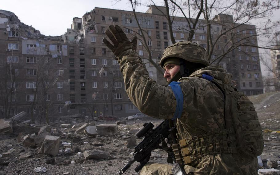 A Ukrainian serviceman guards his position in Mariupol, Ukraine, Saturday, March 12, 2022. Ukrainian military says Russian forces have captured the eastern outskirts of the besieged city of Mariupol. But Russia is struggling to supply its forces with the most basic requirements three weeks after its troops invaded Ukraine, a senior U.S. defense official said Thursday, March 17, 2022.