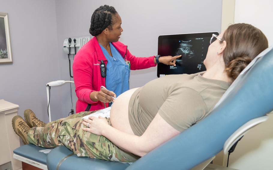 Lt. Col. Francesca Desriviere, a certified nurse midwife at Martin Army Community Hospital at Fort Moore, Ga., conducts an abdominal ultrasound during a routine obstetrics appointment.