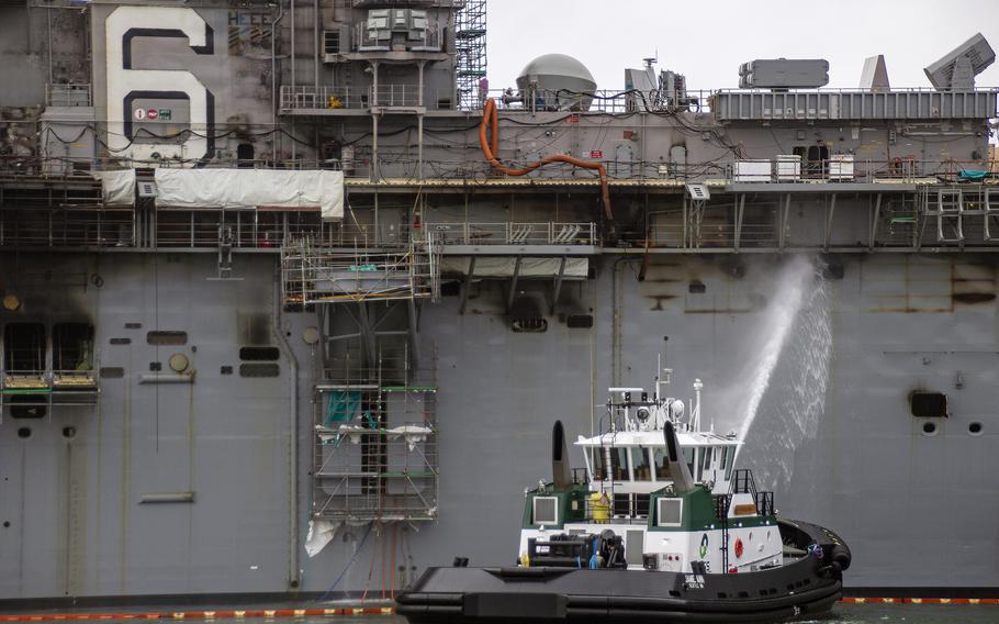 Sailors and firefighters combat a blaze aboard the amphibious assault ship USS Bonhomme Richard at Naval Base San Diego, July 14, 2020. 