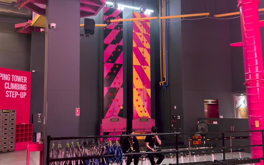 Brightly colored climbing walls and a jumping tower.