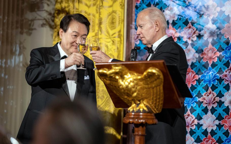 President Joe Biden and South Korean President Yoon Suk Yeol make a toast during at the White House, April 26, 2023. 