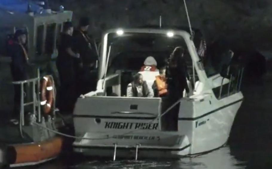 The U.S. Coast Guard and the Huntington Beach Fire Department rescued a dozen migrants from a boat that washed ashore in Orange County on Tuesday, according to authorities.