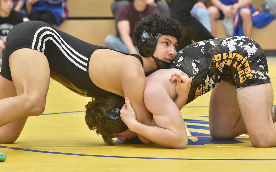 Vilseck’s Jaden Freeman, left, and Stuttgart’s Zachary Call battled fairly evenly in a 144-pound semifinal match at the DODEA-Europe Wrestling Championships on Saturday, Feb. 10, 2024, before Call went on to a 6-3 decision.