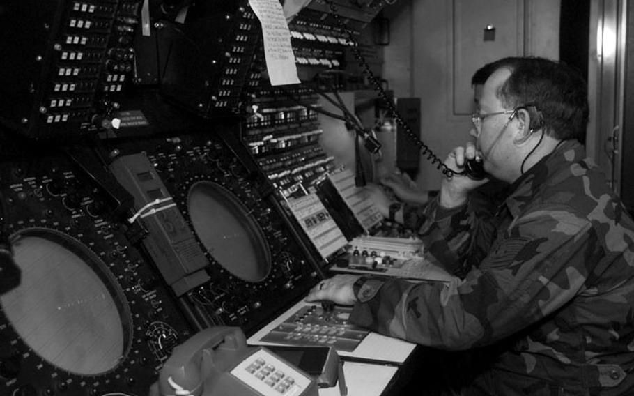 Taszar AB, Hungary, January, 1996: Air Force reservists guide incoming aircraft to Taszar's landing strip during initial stages of Operation Joint Endeavor.