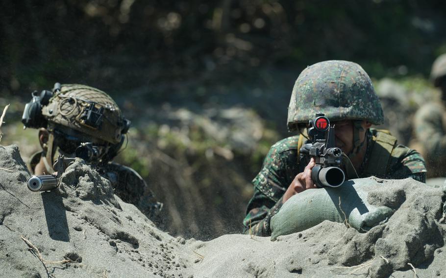 U.S. and Philippine Marines provide security for a bilateral amphibious landing in Claveria, Philippines, March 31, 2022, during the annual Balikatan  exercise. 
