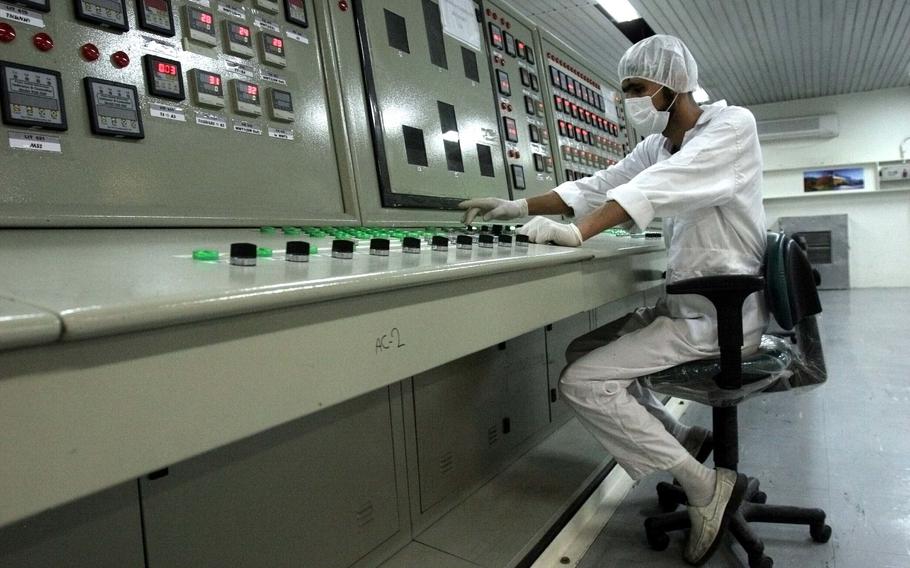 FILE - A technician works at the Uranium Conversion Facility just outside the city of Isfahan, Iran, 255 miles (410 kilometers) south of the capital Tehran, Iran, Feb. 3, 2007. The United Nations' atomic watchdog says it believes Iran has further increased its stockpile of highly enriched uranium in breach of a 2015 accord with world powers. (AP Photo/Vahid Salemi, file)