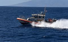 A Coast Guard Response Boat-Medium crew conducts search patterns by water during a search and rescue exercise near Kapalua, Maui, Oct. 24, 2019.