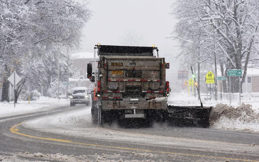 A Michigan Dept. of Transportation snowplow clears a section of M-139 during a late fall snowstorm Wednesday, Nov. 16, 2022, near downtown Berrien Springs, Mich.