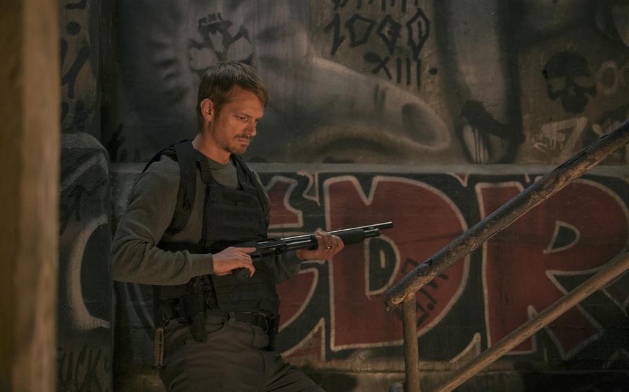 Joel Kinnaman plays Godlock, a man trying to avenge his son’s murder, in “Silent Night.”