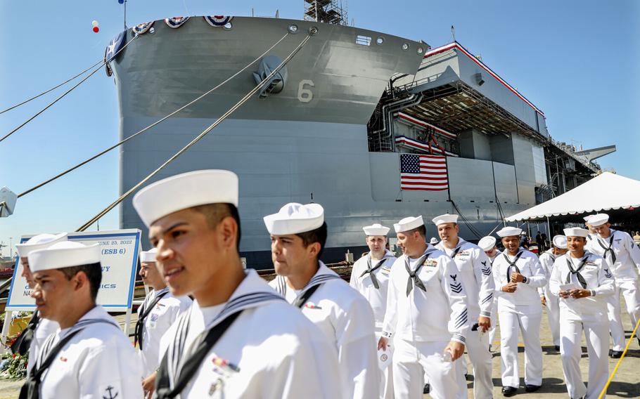 Navy Sailors attached to the USS John Canley walk out after the ship's christening ceremony at NASSCO on Saturday, June 25, 2022 2022. 