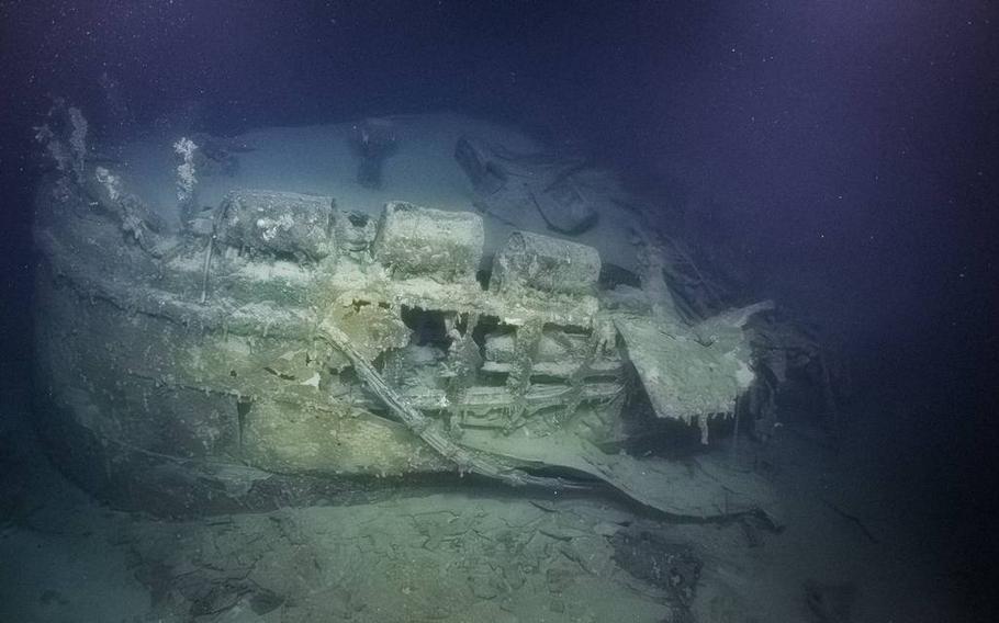 The stern of a ship underwater.