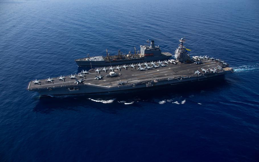 Aircraft carrier USS Gerald R. Ford steams alongside USNS Laramie during a fueling-at-sea in the eastern Mediterranean Sea, Oct. 11, 2023. 