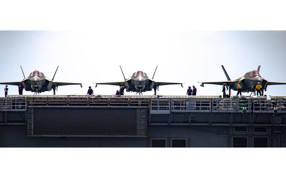 F-35B Lightning II aircraft from Marine Fighter Attack Squadron 122, 13th Marine Expeditionary Unit, sit aboard the amphibious assault ship USS Makin Island in the South China Sea, Feb. 15, 2023.