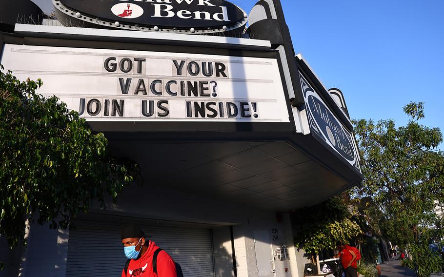 A sign reads “Got Your Vaccine? Join Us Inside!” above a restaurant on Nov. 8, 2021, in Los Angeles, California. 