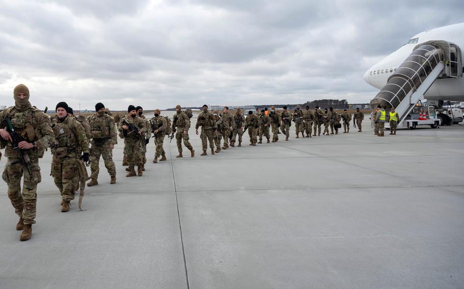 Soldiers assigned to the U.S. Army 82nd Airborne Division disembark from a Boeing 747 at Rzeszów-Jasionka Airport in Poland on Feb. 8, 2022. As the Pentagon shifts forces in the wake of Russia’s war on Ukraine, the number of U.S. troops in Europe has grown to 100,000, the highest level since 2005, U.S. European Command data shows.