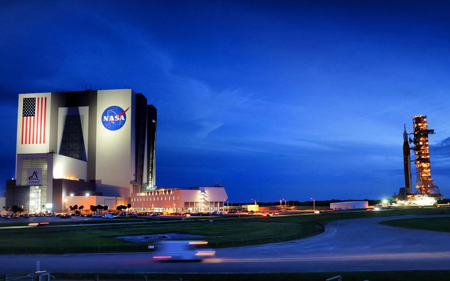 Taking shelter from potential impact brought by Hurricane Ian, NASA’s Artemis I is rolled back to the Vehicle Assembly Building early Tuesday, Sept. 27, 2022, at Kennedy Space Center, Fla.