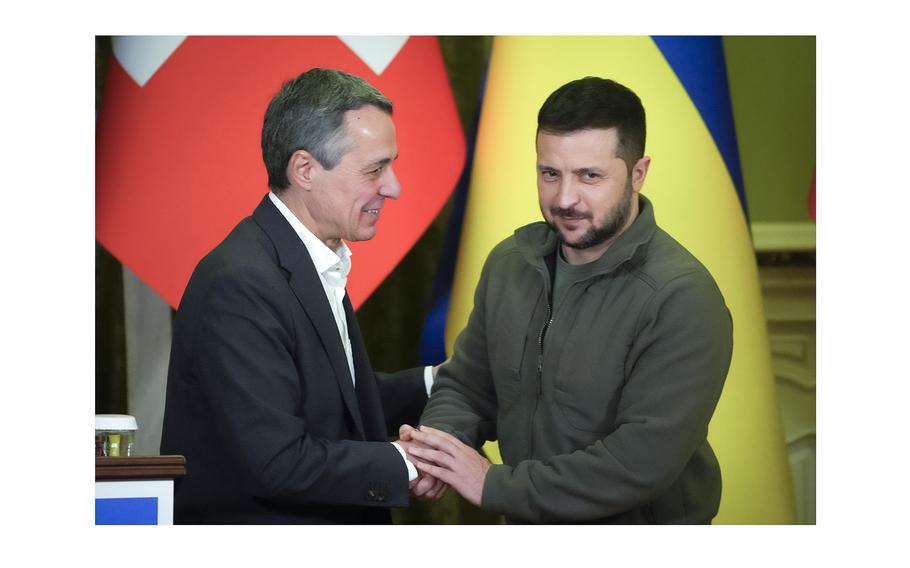 Ukrainian President Volodymyr Zelenskyy, right, shakes hands with Swiss President Ignazio Cassis in Kyiv, Ukraine, on Oct. 20, 2022. Switzerland’s government said Wednesday April 10, 2024 it will host a high-level international conference in June to help chart a path toward peace in Ukraine.