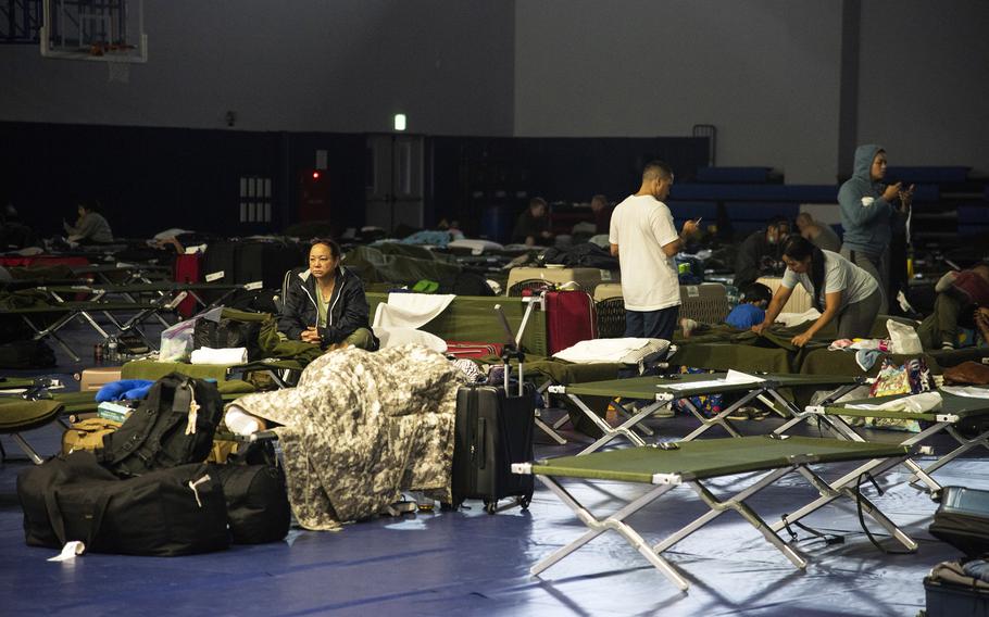 Many delayed Patriot Express passengers slept on cots inside a gym at Marine Corps Air Station Iwakuni, Japan, after a hard landing on Tuesday, July 13, 2021, forced their flight to return to Tokyo for repairs. 