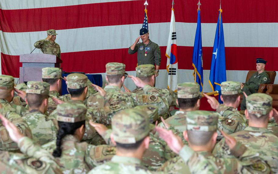 Air Force Col. Joshua Wood, outgoing commander of the 51st Fighter Wing, renders a final salute to the wing during a change-of-command ceremony at Osan Air Base, South Korea, Tuesday, June 20, 2023.