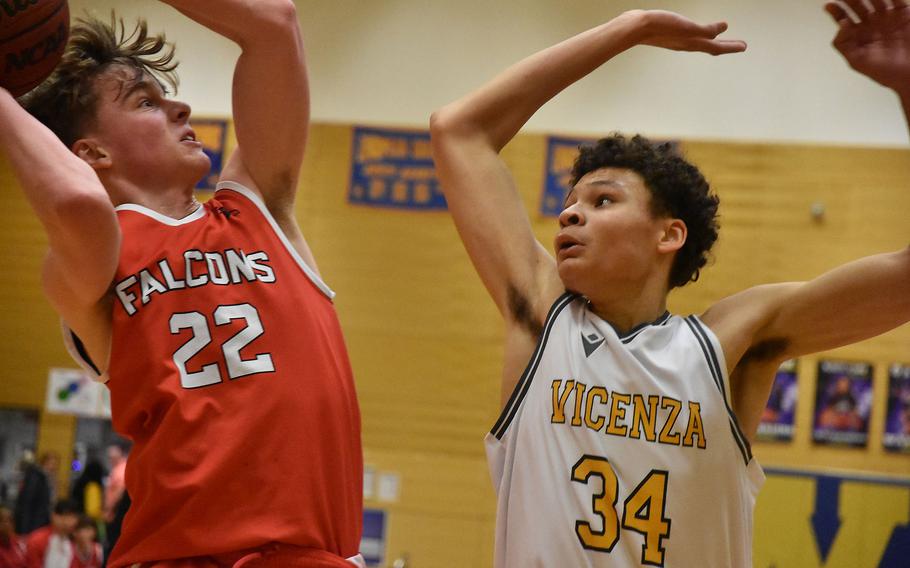 American Overseas School of Rome’s Riley Smith puts up a shot and is challenged by Vicenza’s Simon Gilbert on the opening day of the DODEA European Division II Basketball Championships in Wiesbaden, Germany, on Wednesday, Feb. 14, 2024.