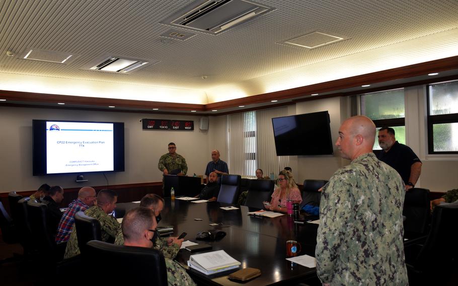 Leaders at Naval Base Yokosuka hold a tabletop exercise simulating a large evacuation on August 18, 2022. 